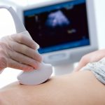 woman getting ultrasound diagnostic from doctor